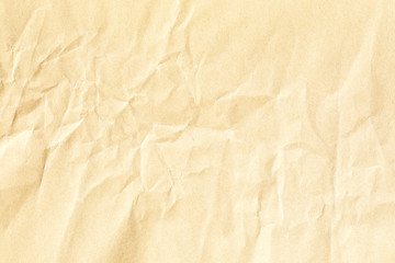 Old pale yellow crumpled paper background texture