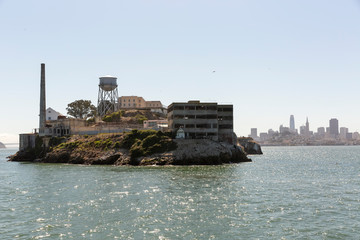 Alcatraz Island and prison with skyline of Downtown San Francisco in the distance behind.