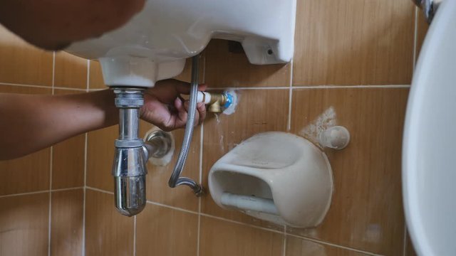 Close up of The technician is installing three-way pipes to divide the water usage to other points in the bathroom.
