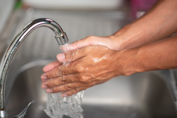 Men's hands are showing ways to wash their hands with a cleaning gel to prevent infectious diseases and prevent the virus.