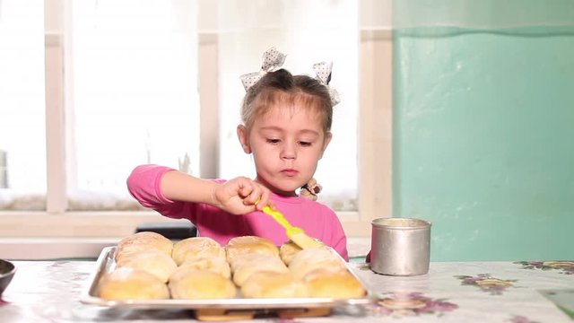 Caucasian 5 years old girl helps her grandmother to prepare home bakery. Family spending time together,  family ties concept 