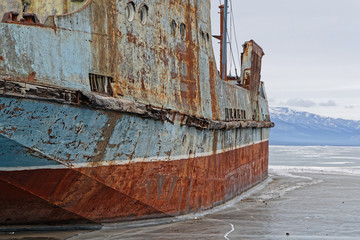KHATGAL, MONGOLIA, February 23, 2020 : Old ships are caught in the ice of Khvosgol Lake. Lake Khövsgöl is the largest fresh water lake in Mongolia, located near the northern border of the land.