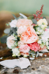 Floristics in the style of fine art in Europe. Light bouquet of peonies and roses. Modern wedding bouquet of the bride.