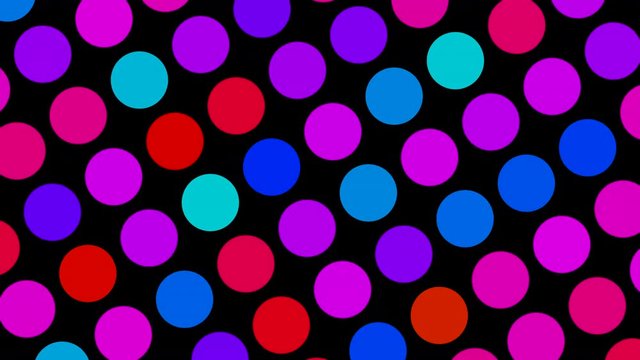 Therapeutic and calming multicolored dots rotating slowly against a black background  - seamless looping. Useful for children with ADHD, Autism or Asperger&nbsp;syndrome.