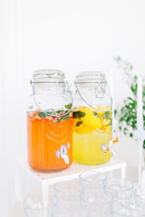 Light decor in the style of fine art. Glasses and tulips in the composition. Table setting for a feast. Wedding table decor in the white Studio.
