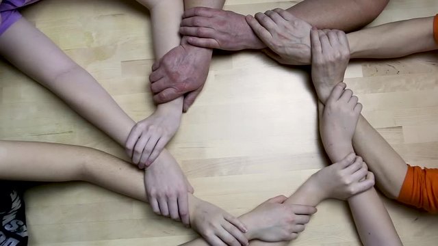 Making hands of people hold together a circle. Friendship, cooperation and support concept