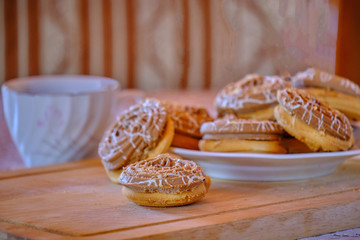 Cookies and coffee on a wooden board