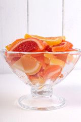 citrus marmalade in a candy bowl on a white background