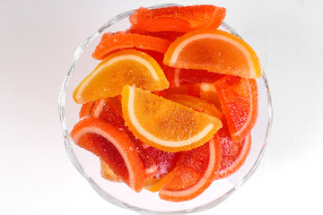 citrus marmalade in a candy bowl on a white background