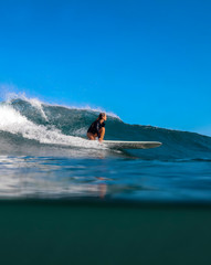 Female surfer on a wave