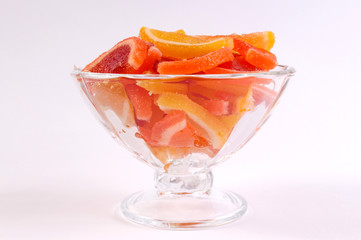 citrus marmalade in a candy bowl on a white background