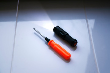 Naklejka premium standard home repair tool kit. flashlight and screwdriver