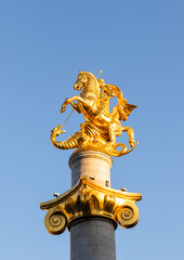 Fototapeta na wymiar Freedom Monument created by Zurab Tsereteli - a monument that depicts St. George killing a dragon in Tbilisi city in Georgia