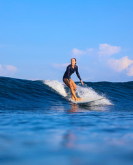 Female surfer on a wave - 331715506