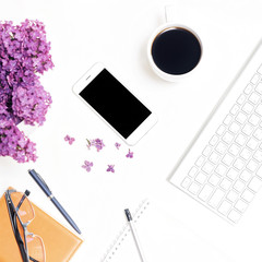 Workplace with keyboard phone coffee notebook pencil pen glasses lilac
