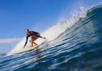 Female surfer on a wave