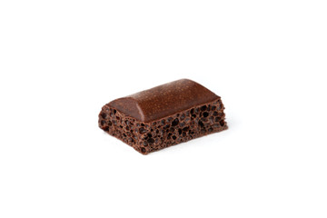 Porous dark chocolate isolated on white background.