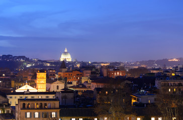 Fototapeta premium Night longexposure shot of the magnificent city of Rome seen at sunset time from a garden on the hills, some famous monuments are visible 