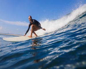 Female surfer on a wave