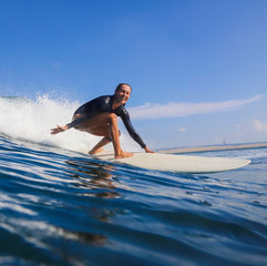 Female surfer on a wave - 331717346