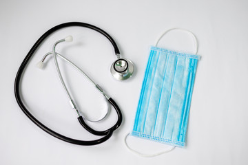 stethoscope and protective bandage on face