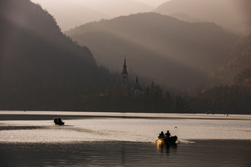Afternoon lights at Bled Lake, Slovenia, Europe. St. Martin church in the background. - 331717366