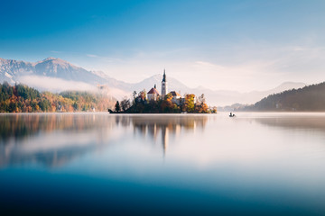 Amazing view on a misty morning of lake Bled with St. Marys Church of the Assumption on the small island; Bled, Slovenia, Europe. - 331717954