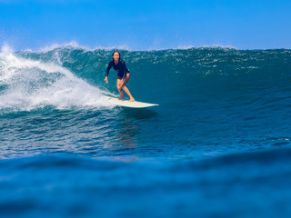Female surfer on a wave