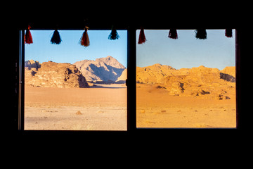 View on the Wadi Rum desert through the windows of a Bedouin tent in Jordan. 