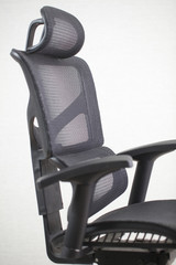 Old dirty office ergonomic chair with mesh coating.