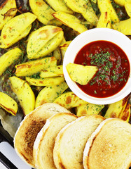 fried potatoes with tomato sauce on a saucer