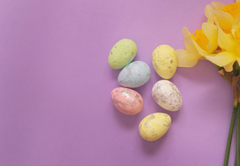 Mini easter eggs on pink background.