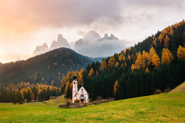 Val di Funes, Dolomites, Santa Maddalena with famous San Giovanni church and peaks of the alps, South Tirol, Italy. Popular tourist attraction. Beautiful Europe.