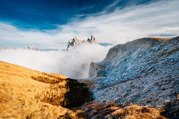 View from Seceda, Odle mountains in the fog, over the clouds. Amazing unique views in Dolomites mountains, Italy, Europe. - 331720174