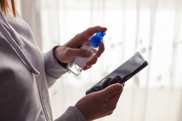 Fototapeta premium Precautions regarding coronavirus, cell phone disinfection