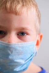 boy face in medical mask virus protection