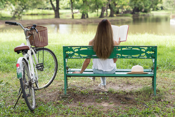 woman read book at spring park