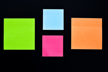 Fototapeta premium Four post its on black background