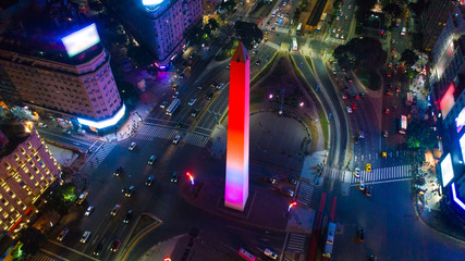 Night aerial view of the Obelisk of Buenos Aires (Obelisco), a historical monument, in the Plaza de la República on 9 de Julio avenues, Buenos Aires - Argentina.