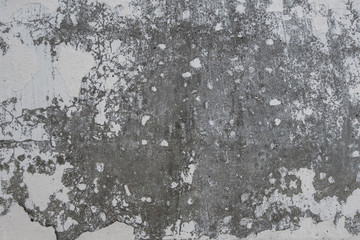 cracked white paint on concrete wall