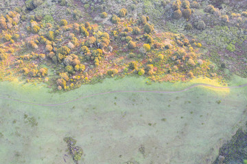Early morning sunlight shines on the green hills of the East Bay in Northern California. This open area, east of San Francisco Bay, is green in the winter due to rain and golden during the summer.