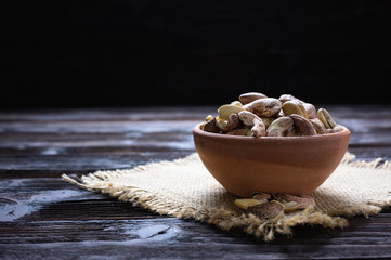 Roasted cashews on natural wooden table background
