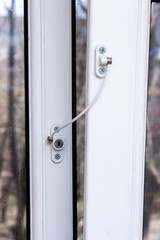 Protection on windows from falling out of children. clasps.  Cable safety guard prevent of opening window by child. Prevention of falling accident