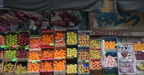 street fruit market selling oranges apples assorted fruit