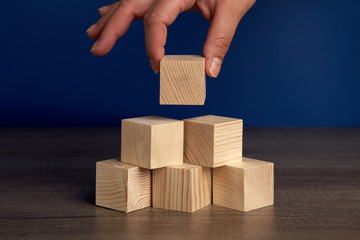 Wooden blocks and cubes ready for adding text and word that can be used to convey a message or a...