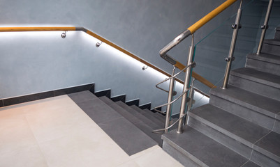 Stainless steel, glass and wood railing.Fall Protection. modern design of handrail and staircase