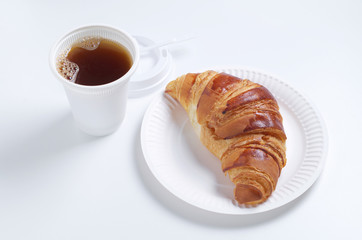 Croissant and coffee cup