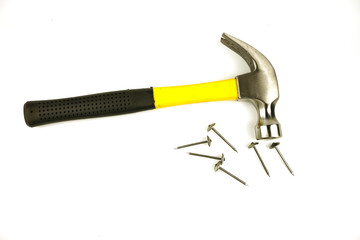 Hammer and nails of various sizes Isolated on white background.