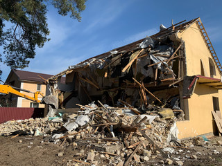 Ruined, brick, residential building. The ruins of a collapsed mansion in the forest. Demolition of...