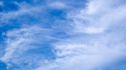 blue sky horizontal with beautiful puffy fluffy clouds with sunlight, abstract nature background